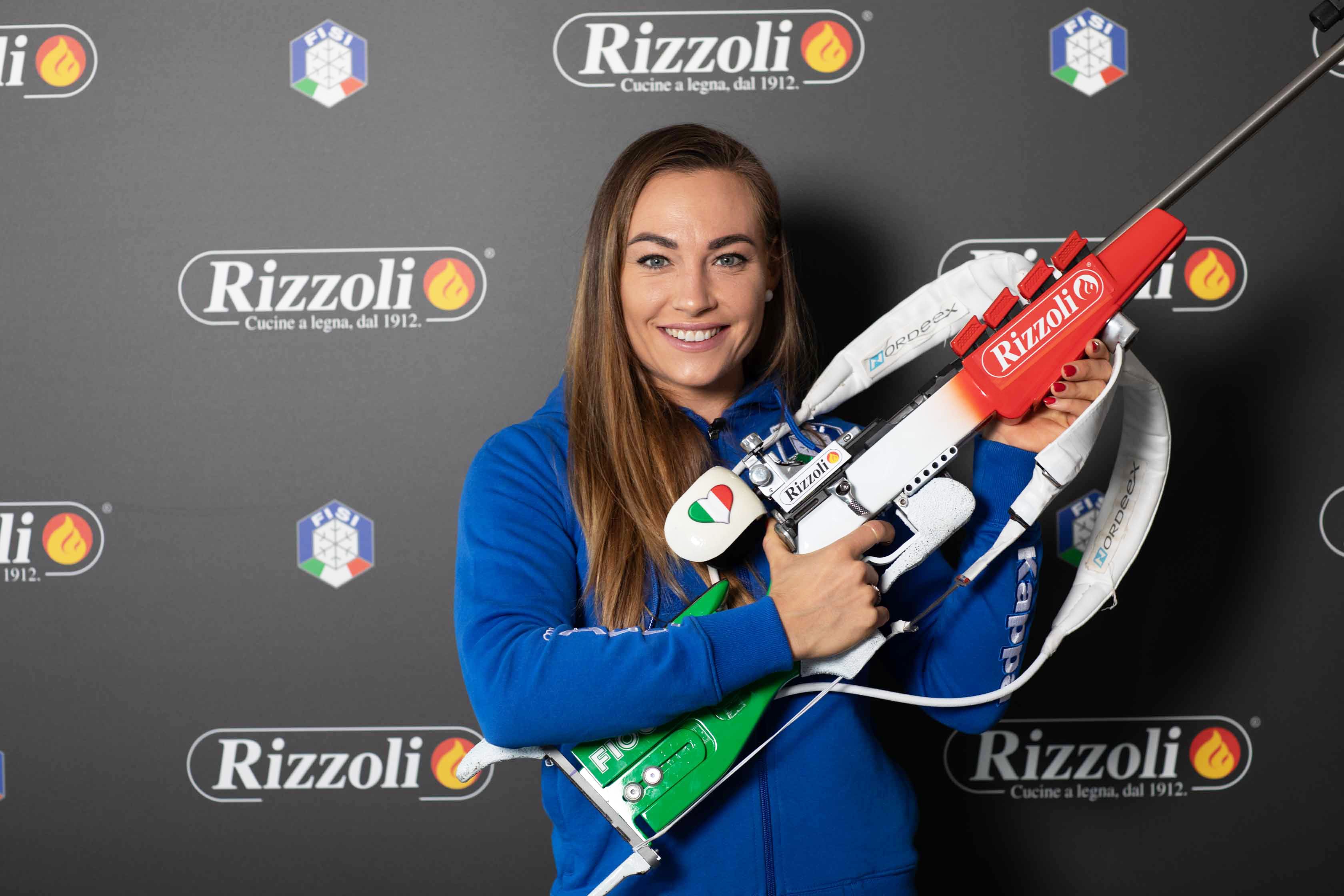 Rizzoli und Dorothea Wierer. Gemeinsam im Zeichen des Sports. 